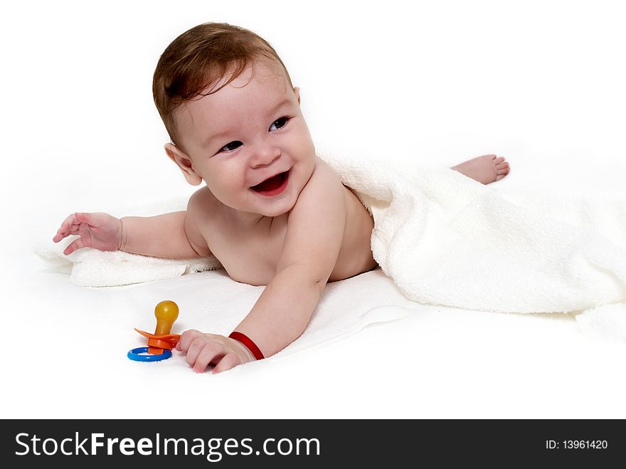 Portrait of the little boy under a terry towel