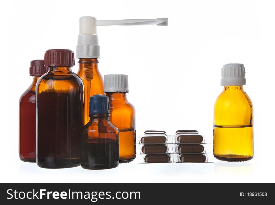 Medical supplies - vial bottles and pills on white background. Medical supplies - vial bottles and pills on white background