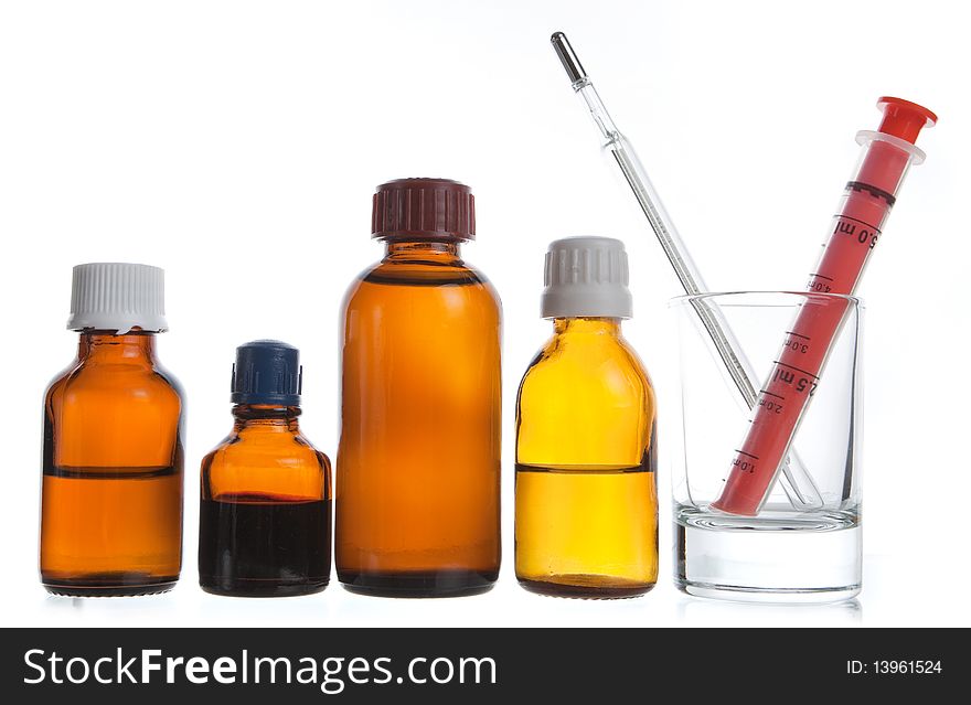 Medical supplies - vial bottles and pills on white background. Medical supplies - vial bottles and pills on white background