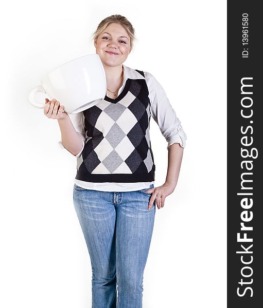 The beautiful young woman holding big coffee cup. The beautiful young woman holding big coffee cup