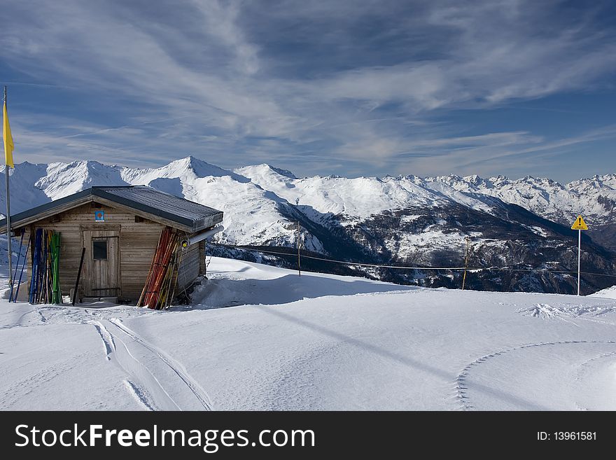 Lonely small house  on a mounting skiing resort in alps. Lonely small house  on a mounting skiing resort in alps