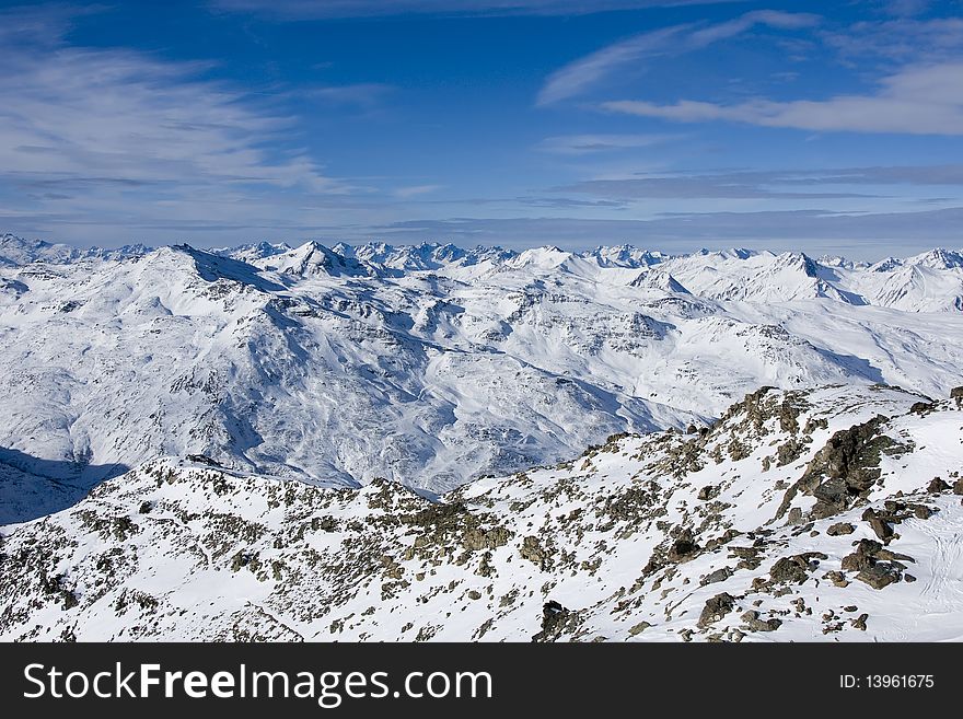 Sunny day on a mounting skiing resort in alps. Sunny day on a mounting skiing resort in alps