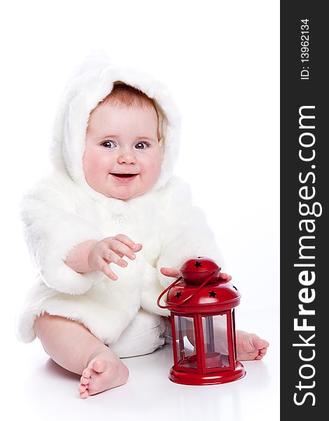 Cute little girl with a warm coat on white background