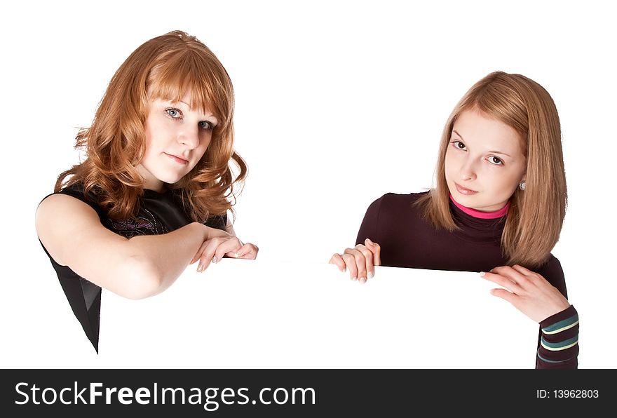 Two girls with white paper in hands. Isolated on white