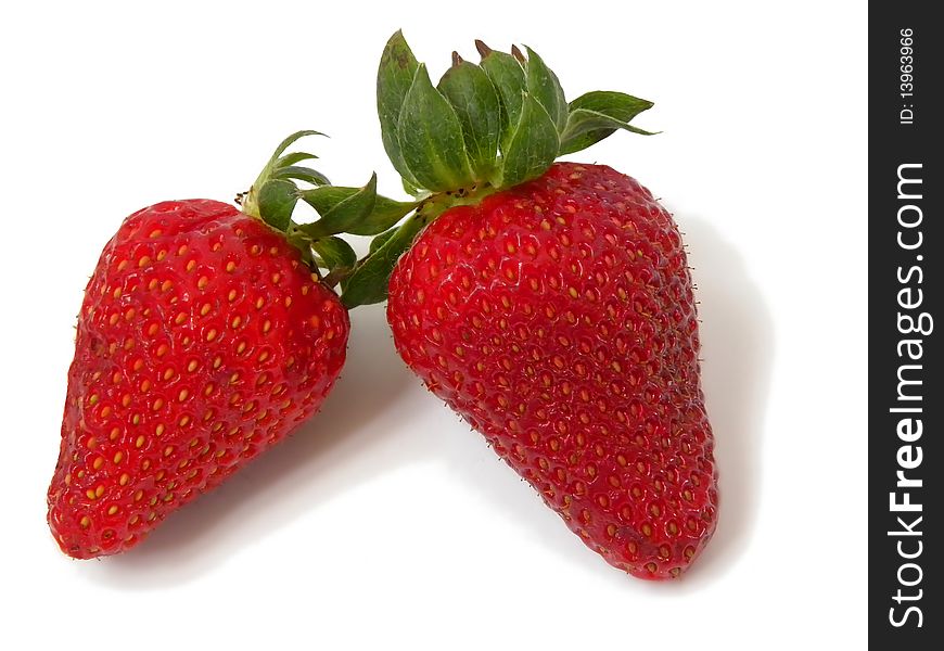 Two juicy ripe strawberries isolated on white background