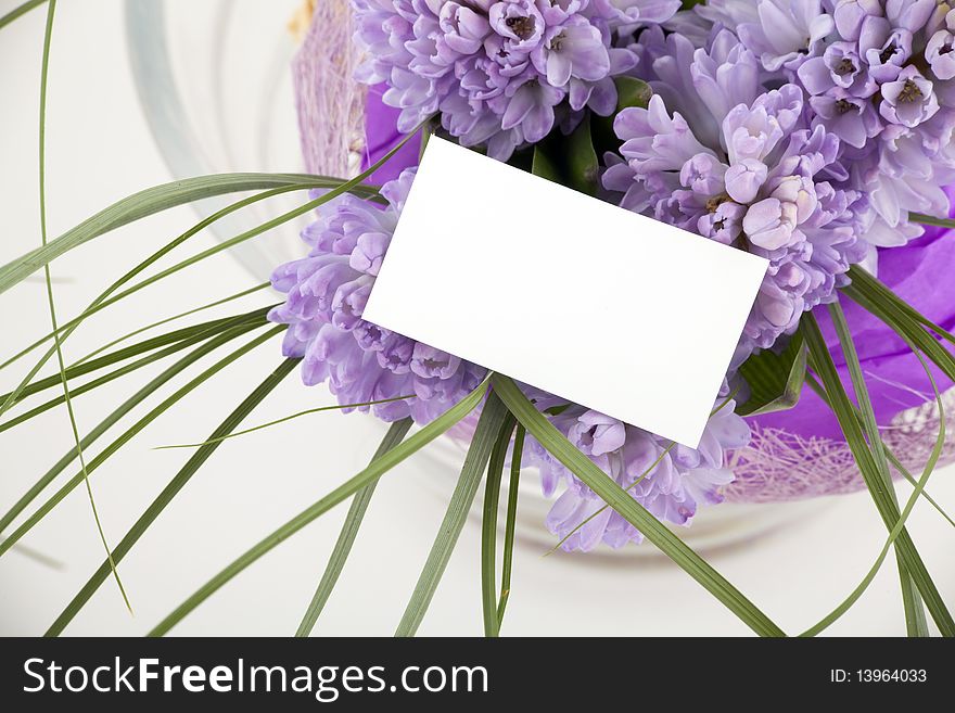 Beautiful bouquet of flowers with blank white card to put your message.