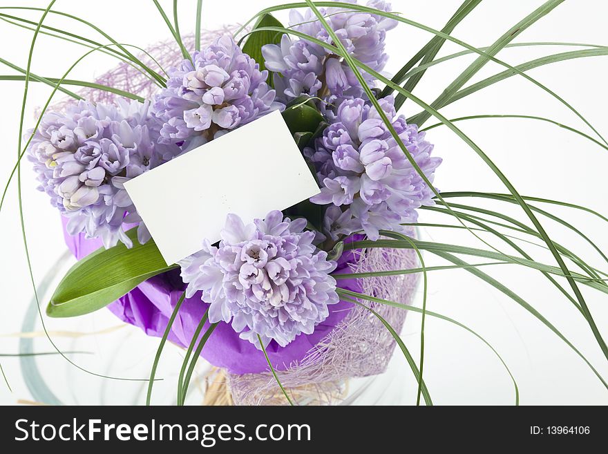 Beautiful bouquet of flowers with blank white card to put your message.