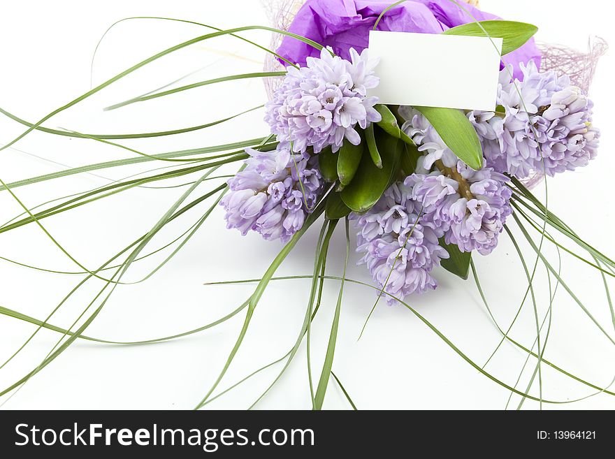 Bouquet of flowers with blank white card