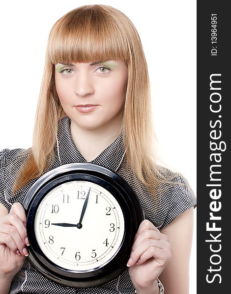 Beautiful young girl holding clock. Ower white