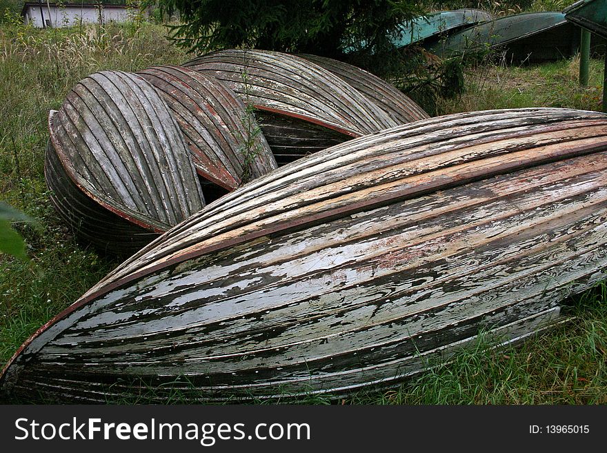 Old dirty wooden boat in the grass. Old dirty wooden boat in the grass