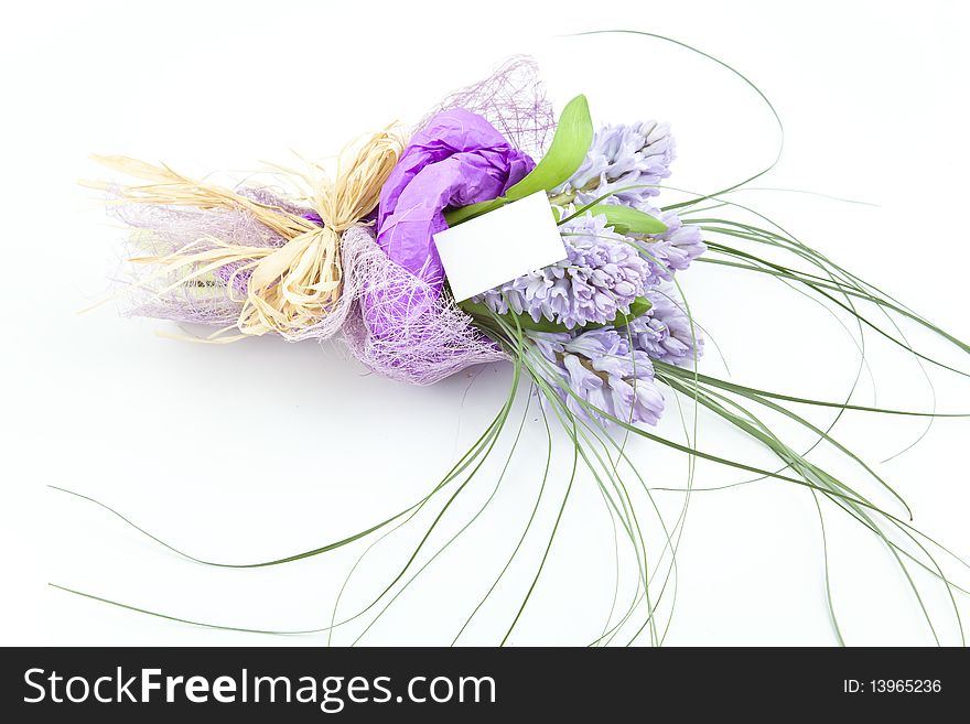 Bouquet of flowers with blank white card