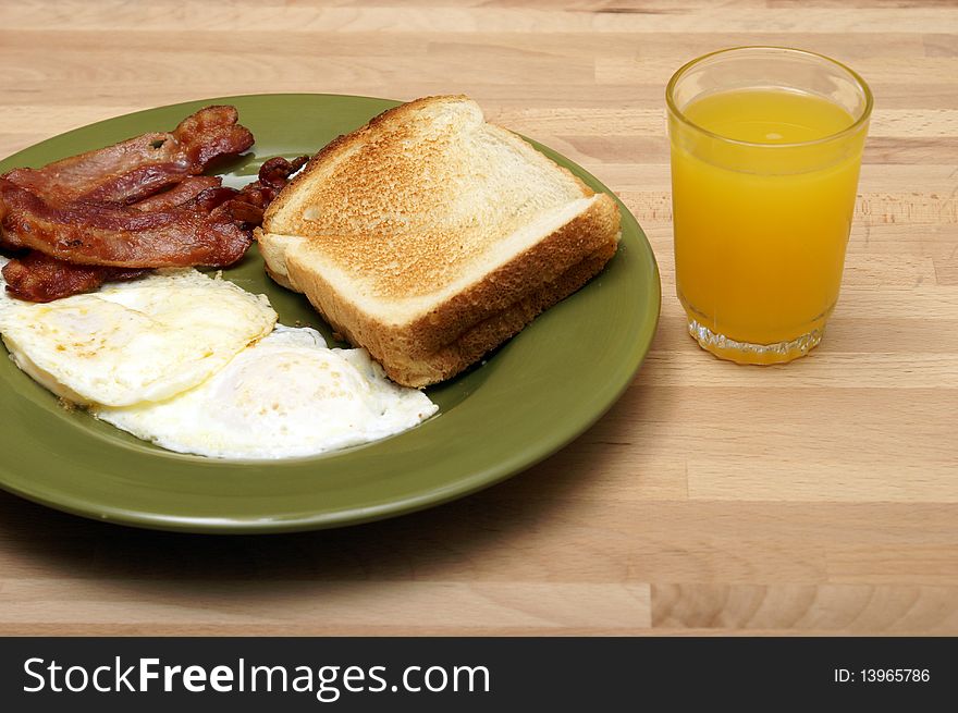 A cooked breakfast of bacon and eggs. A cooked breakfast of bacon and eggs.