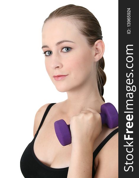 Young blonde exercising with light purple weights. Young blonde exercising with light purple weights
