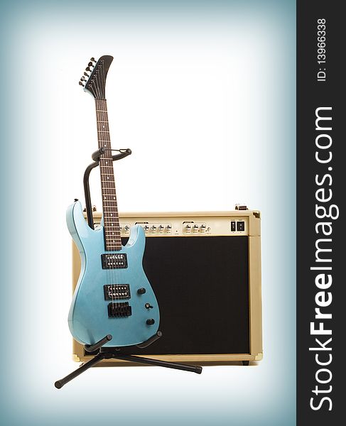 Amplifier and guitar on gradient background