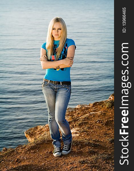 Series. The beautiful blonde on sea background