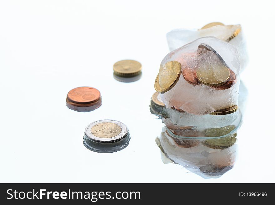 Coins inside ice cubes isolated on white background. Coins inside ice cubes isolated on white background