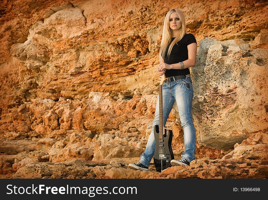 The beautiful blonde with a guitar