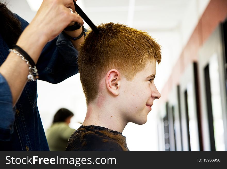 Smiling Boy With Red Hair At The Hairdresser