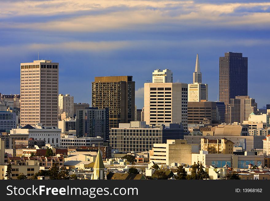 San Francisco downtown buildings at sunset. San Francisco downtown buildings at sunset.