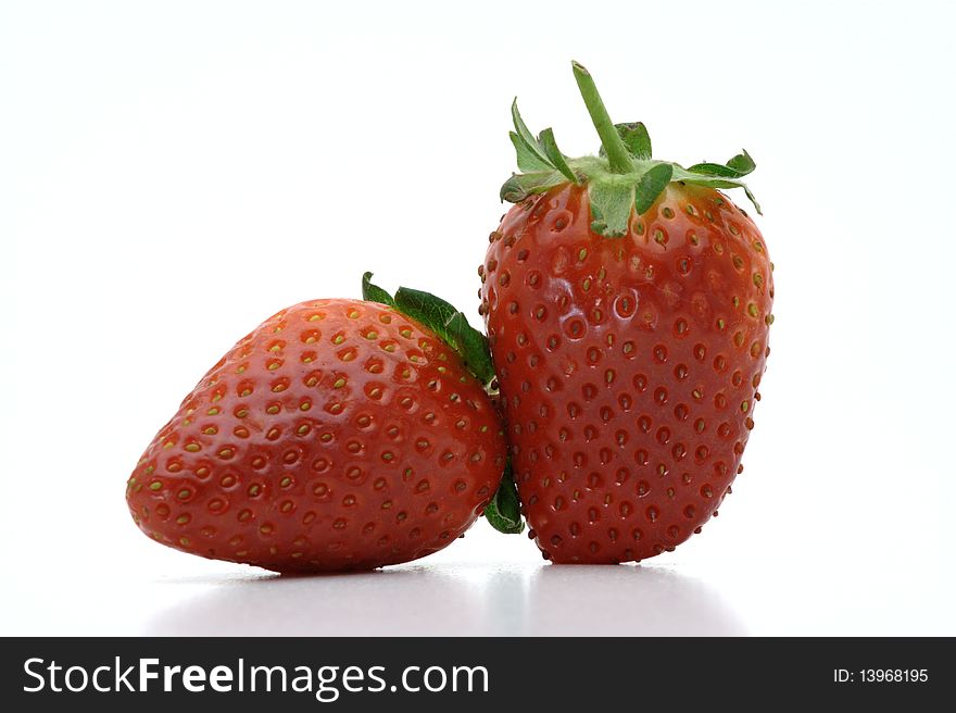 A Pair Of Strawberries On A White Background