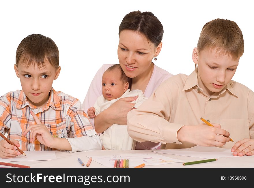 Young mother with two sons and newborn at home