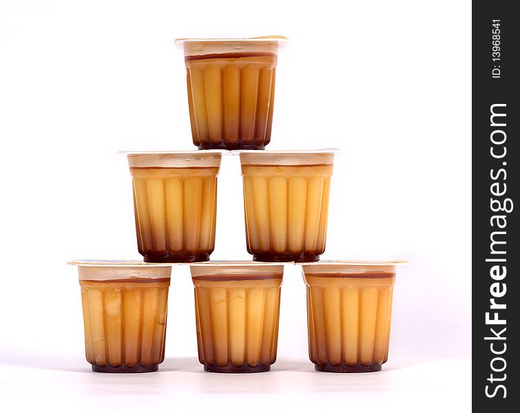 Various puddings piled on a white background. Various puddings piled on a white background