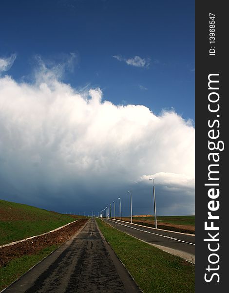 Landscape with road and storm clouds