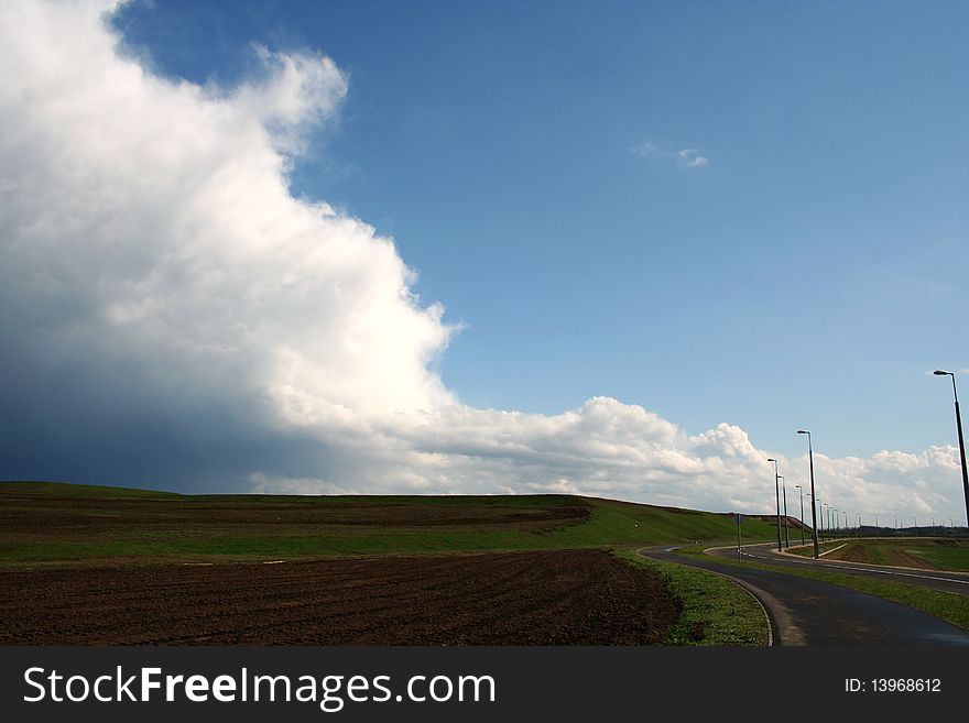 Landscape with road and storm clouds