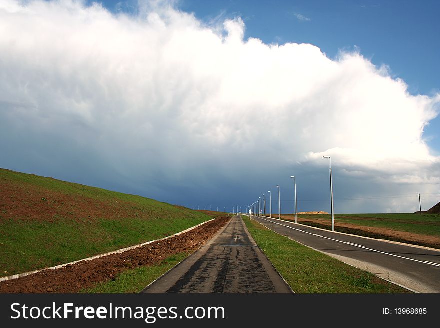 Landscape with road and storm clouds