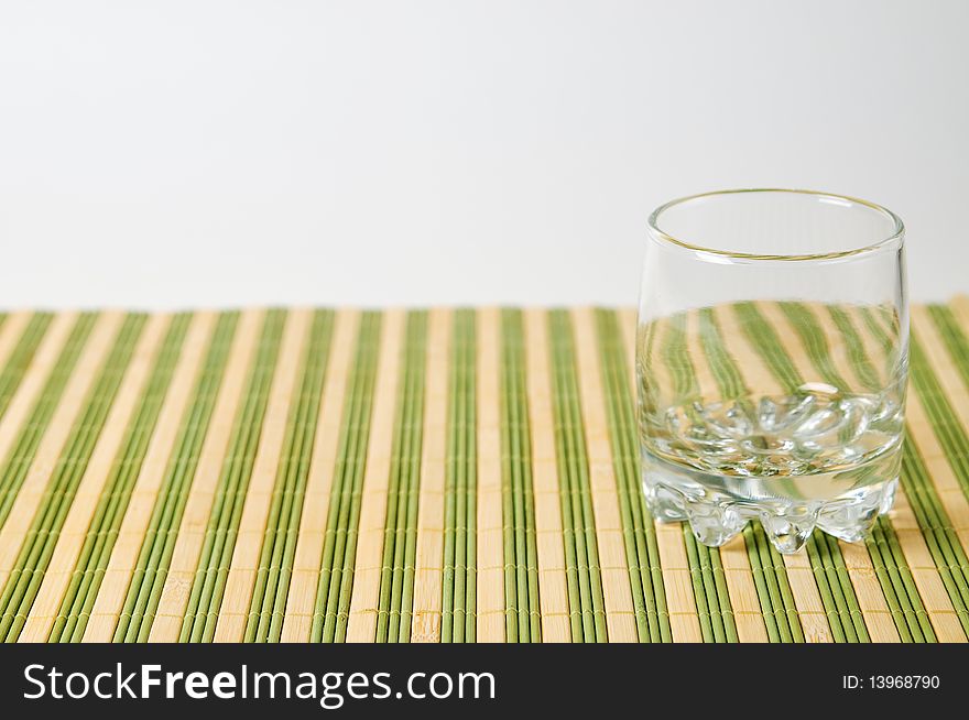 Clean empty glass on stripe surface