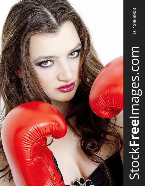 Portrait of young woman with boxing gloves