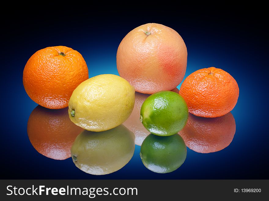 Arrangement of lemon, lime, tangerine, orange and grapefruit fruit. Arrangement of lemon, lime, tangerine, orange and grapefruit fruit