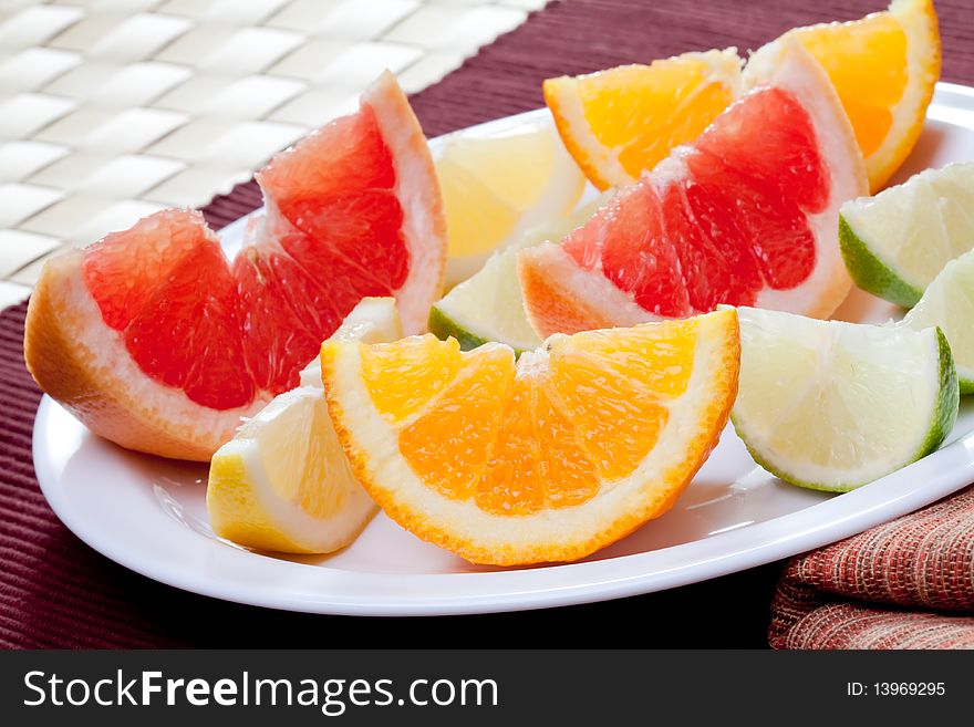 Arrangement of lemon, lime, tangerine, orange and grapefruit fruit. Arrangement of lemon, lime, tangerine, orange and grapefruit fruit