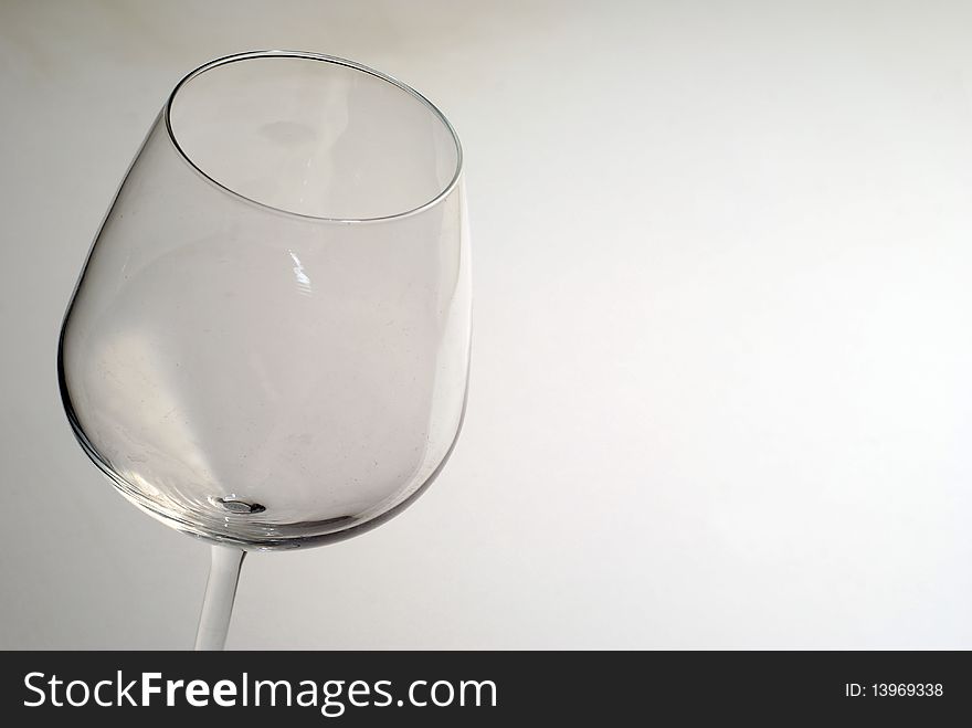 An empty glass of wine on a white background