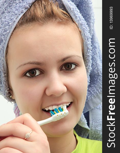 Pretty young girl brushing her teeth. Pretty young girl brushing her teeth