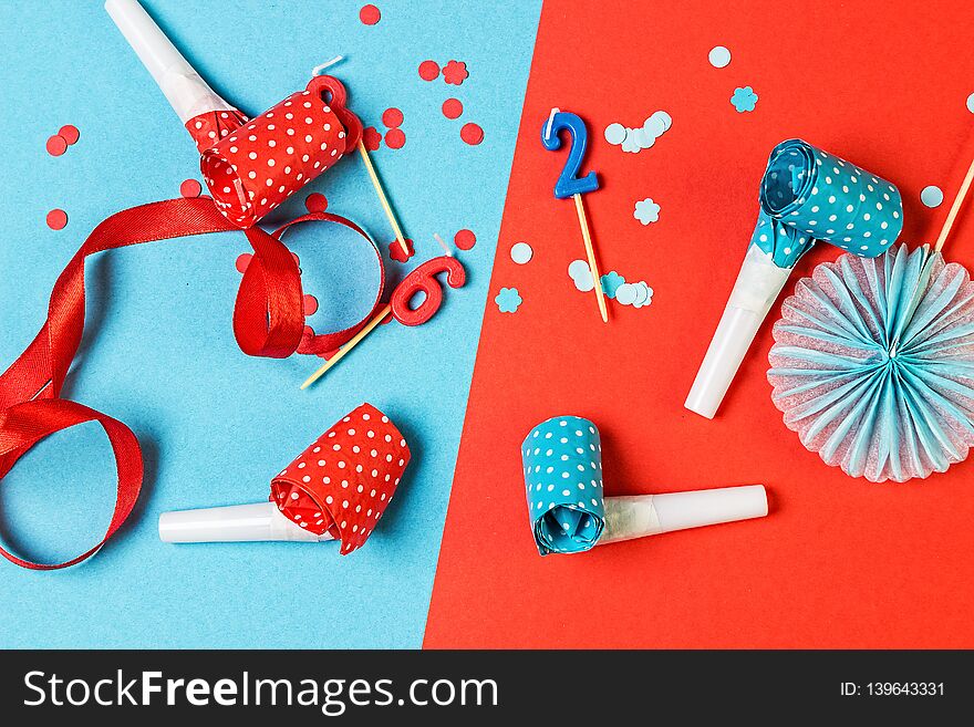 Orange And Blue Festive Background With Candles, Confetti And Other Accessories.