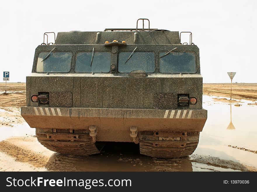 A powerful army truck all-terrain vehicle. Close-up. Day. A powerful army truck all-terrain vehicle. Close-up. Day.