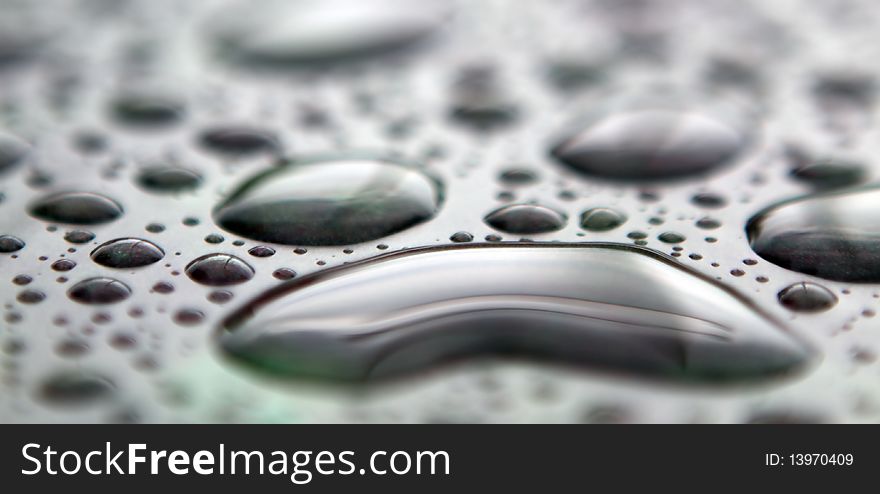 Raindrops on a bench after a storm