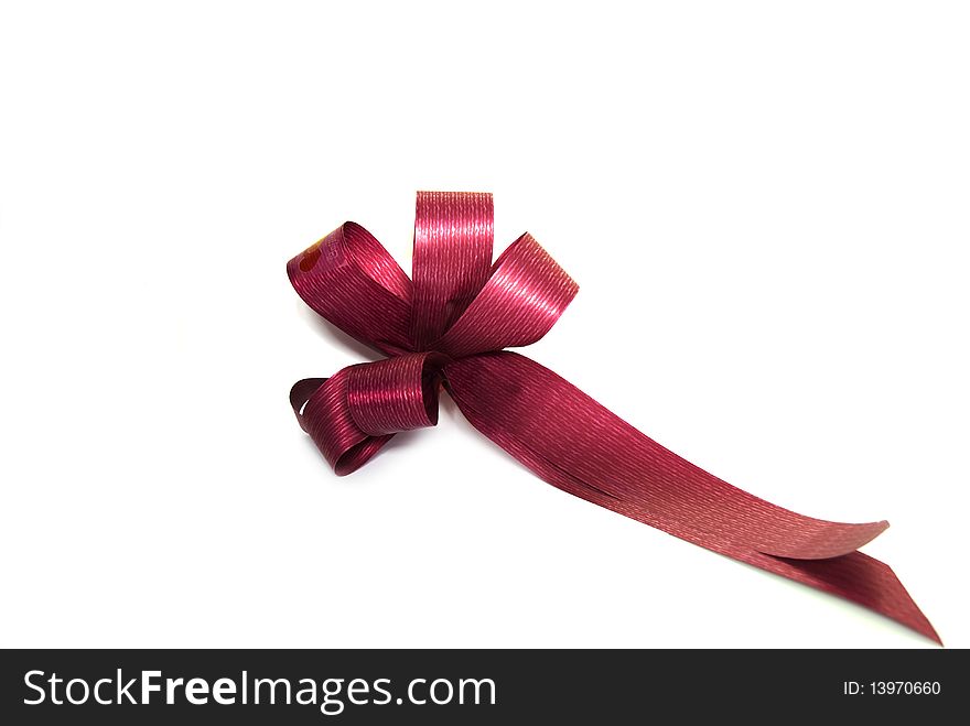 Red paper bow isolated on a white background