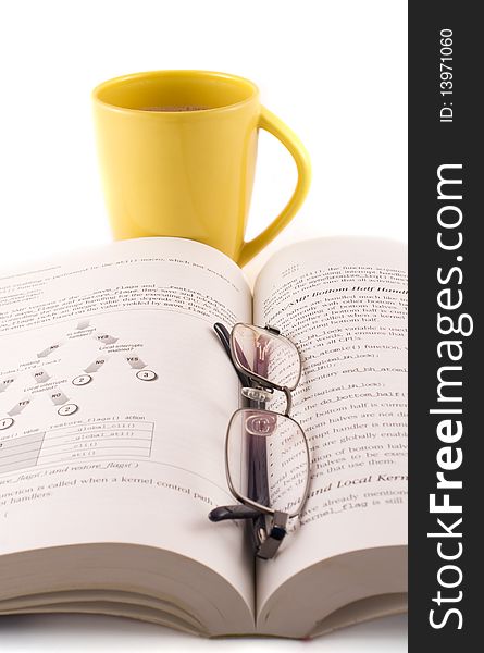 Yellow Cup Of Coffee With A Book And Glasses