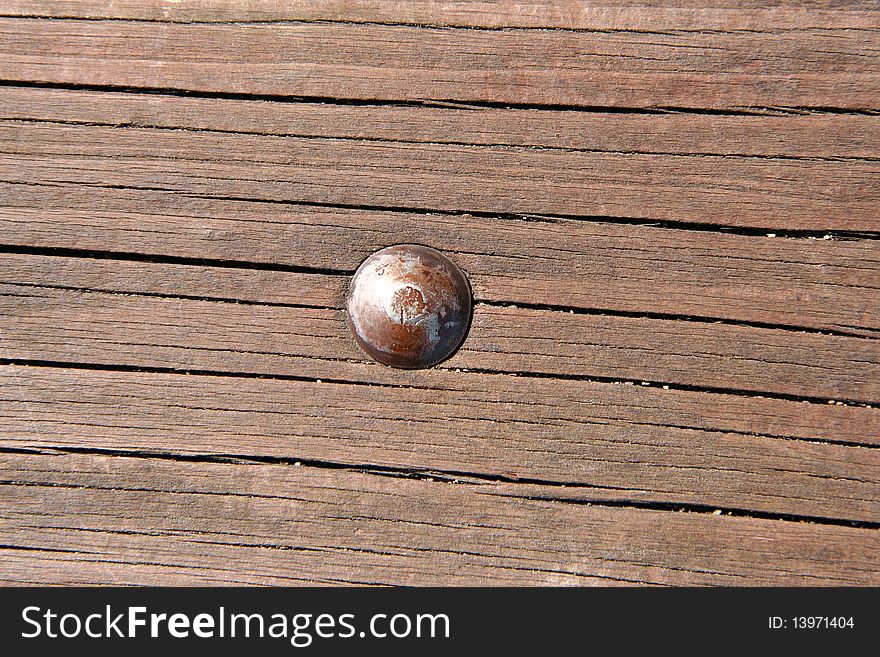 A Wooden texture background with a bolt