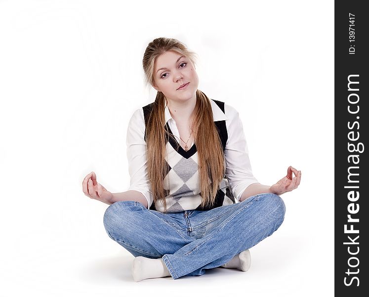 Blond woman meditating in lotus position isolated on white