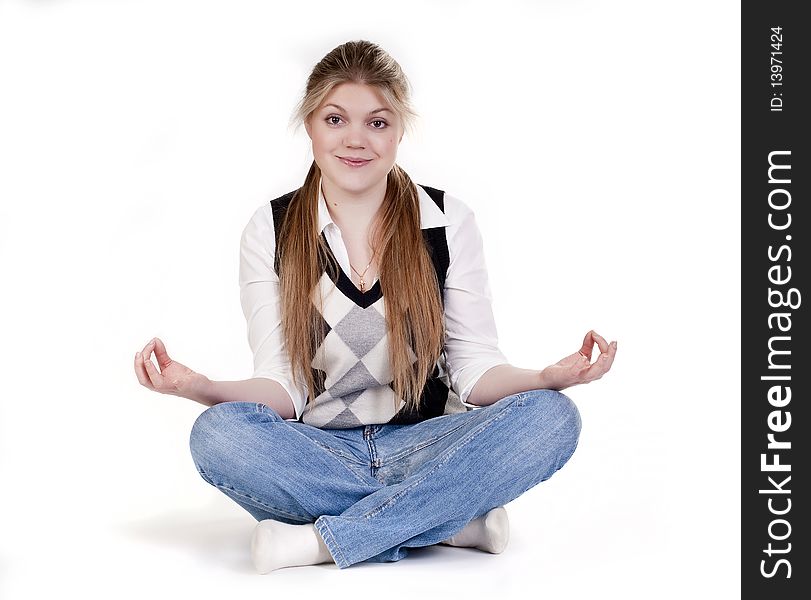 Blond woman meditating in lotus position isolated on white