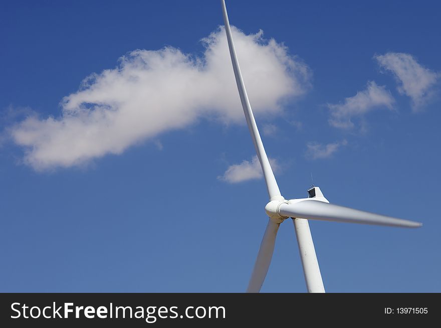 Windmill with blue sky and white clouds