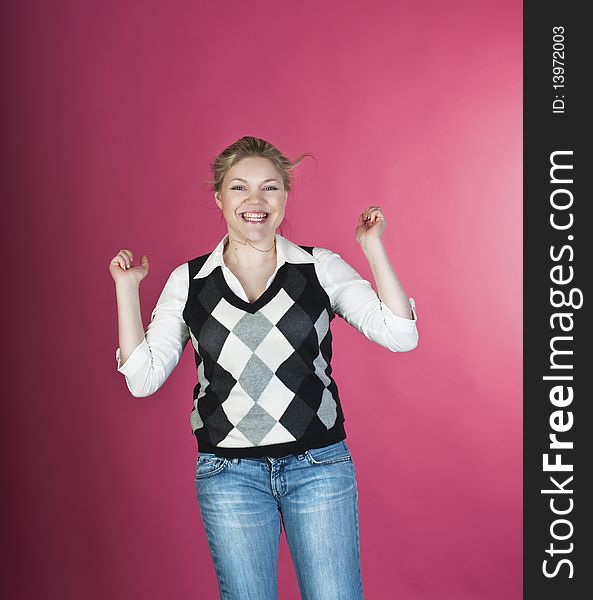 Woman with blond long hair and happy smiling facial expression jumping up. Woman with blond long hair and happy smiling facial expression jumping up