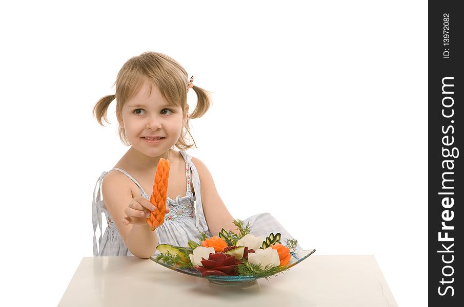 Little girl eating vegetables - isolated