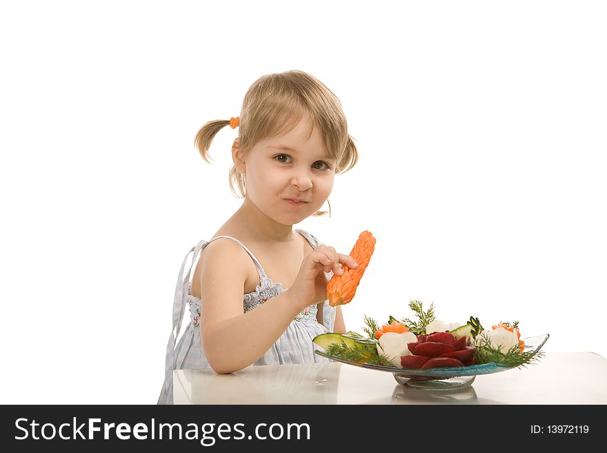 Little girl eating vegetables - isolated