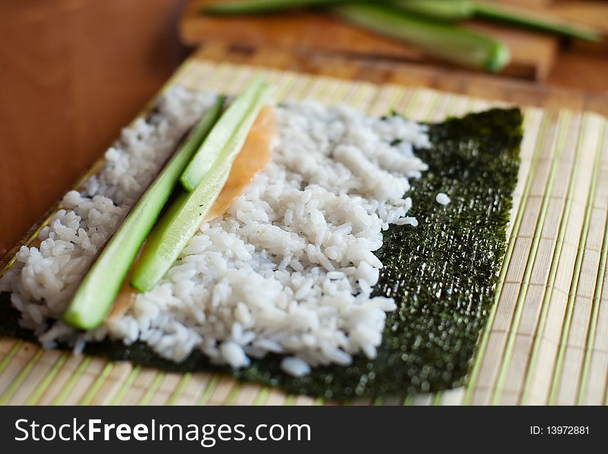 An image of tuna and cucumber on rice. An image of tuna and cucumber on rice