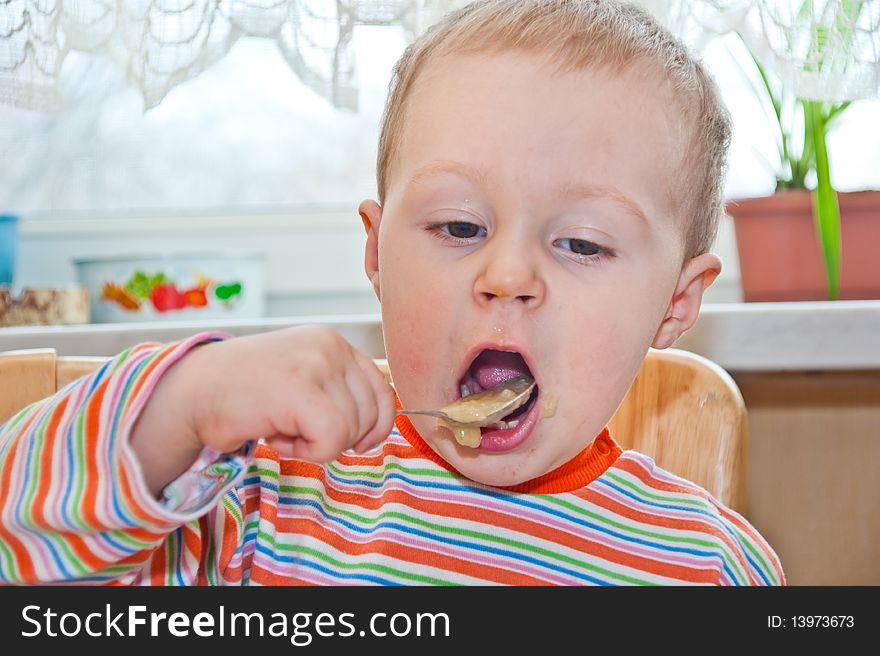 Young Baby Boy With Spoon