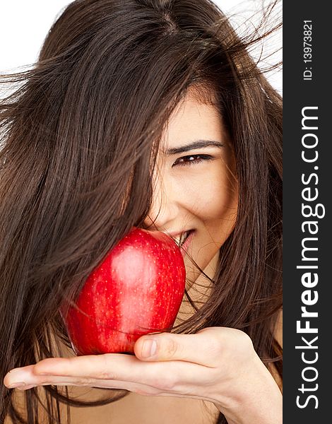 Close-up of a beautiful smiling female holding red apple. Close-up of a beautiful smiling female holding red apple